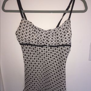 White with black polka dots sheer shirt.